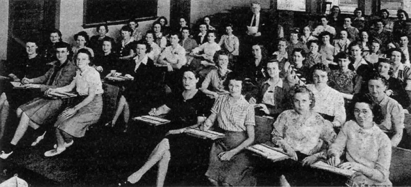 Mueller Co. women in a Millikin University classroom, 1943